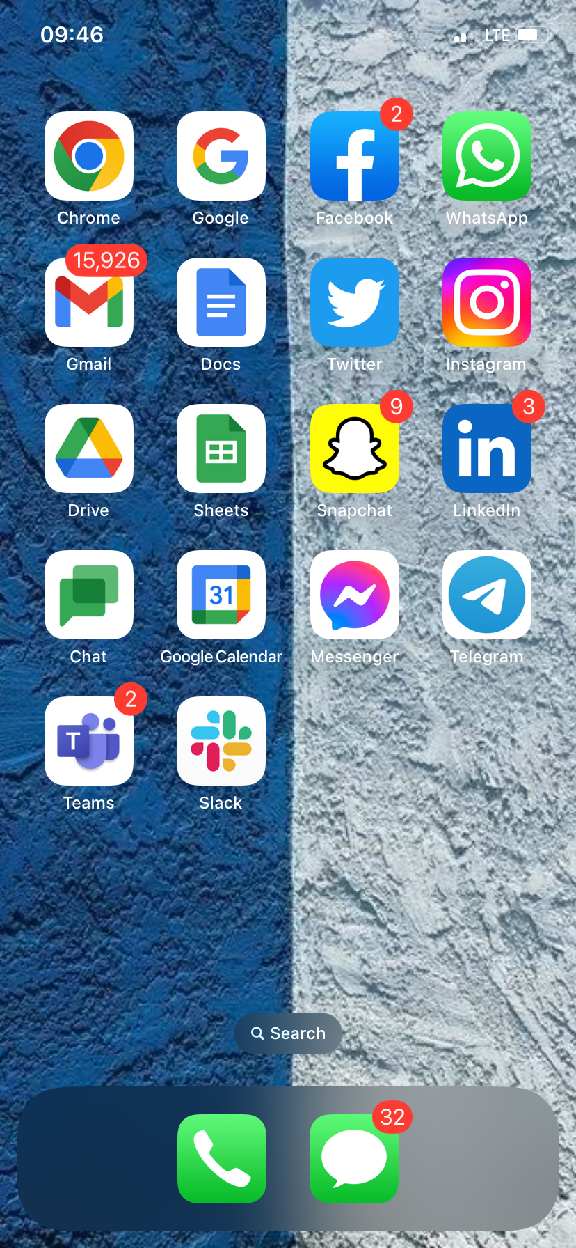 An iPhone home screen that's split down the middle by wallpaper